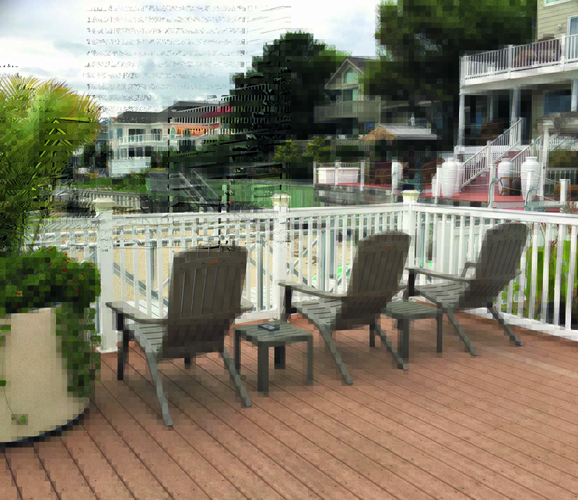 Fauteuil Adirondack gris et sa table basse assortie, sur la terrasse en bois d'un petit port américain
