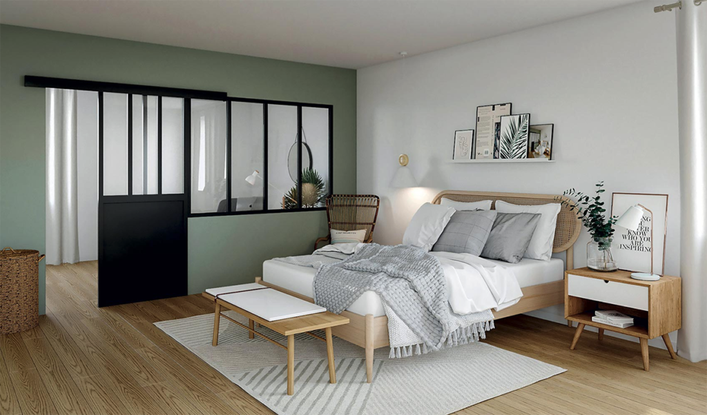 une chambre toute douce esprit atelier d'artiste avec une verrière aluminium laquée noire et un mur vert d'eau